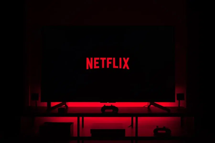 Television showing a streaming app in a dark room