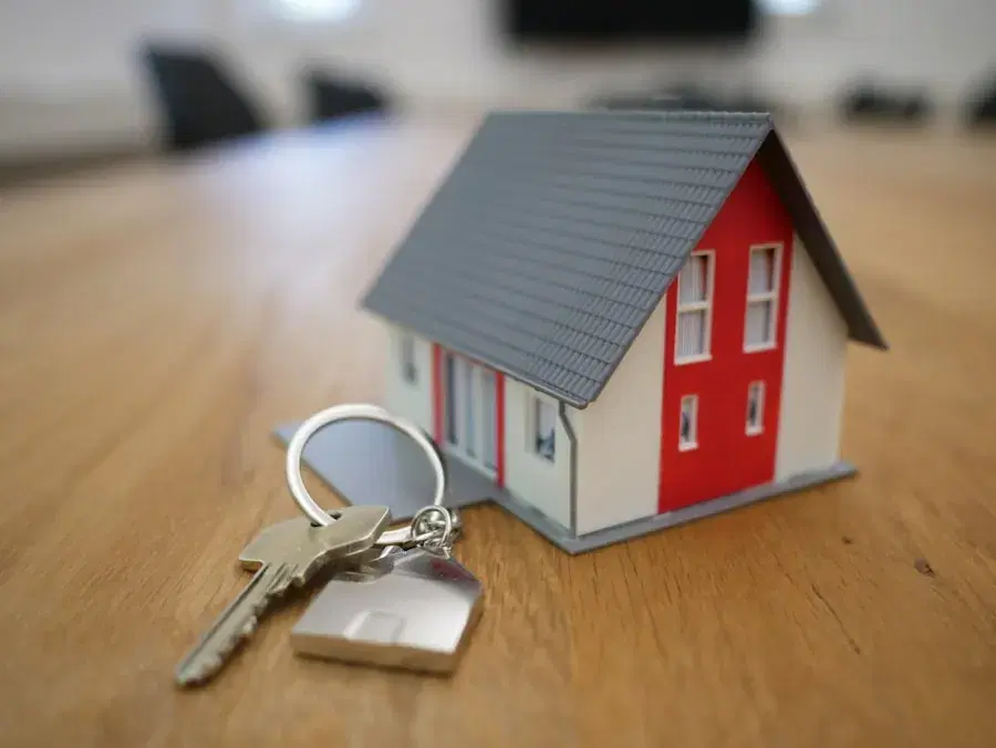 Model house with a set of keys on a table