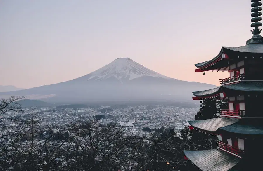 Mount Fuji behind a pagoda at dusk